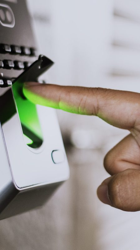 Scanning finger on a coronavirus contaminated fingerprint access control